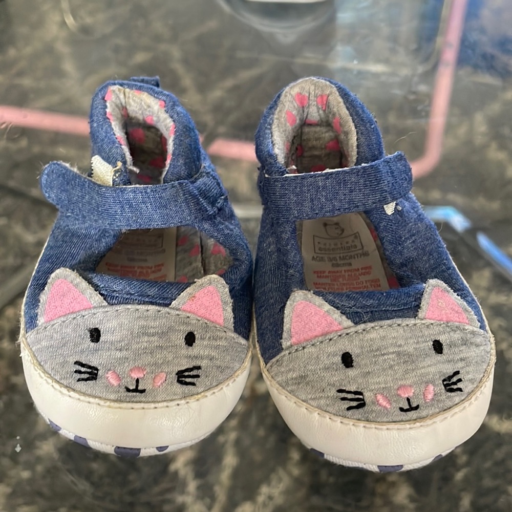 Dark blue, kitty cat, baby shoes.